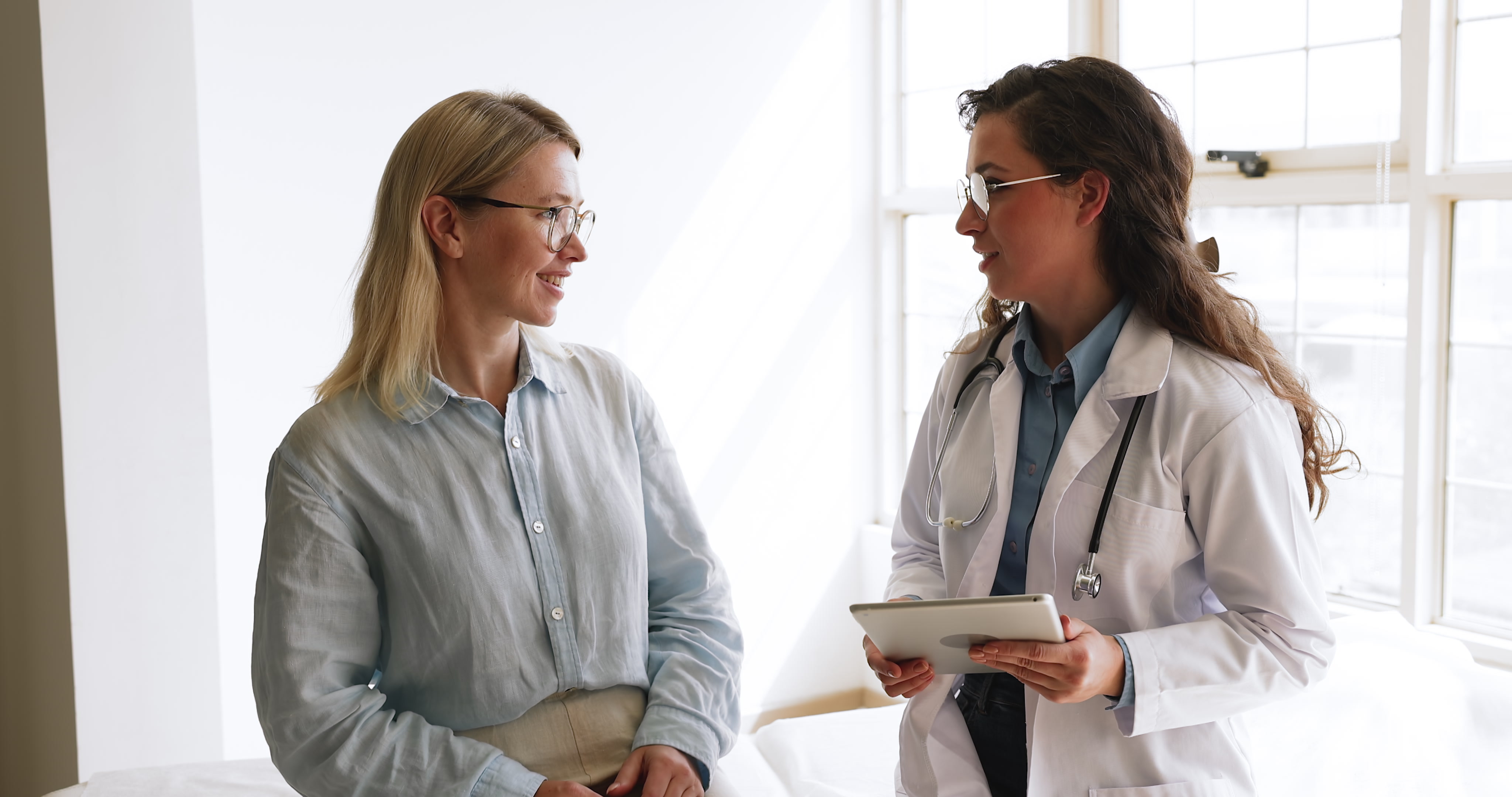 Physician having a warm conversation with patient